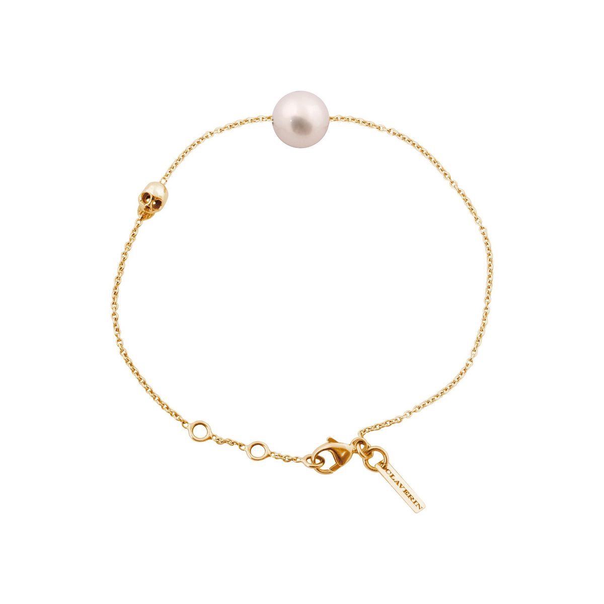 Bracelet Claverin en or jaune 18 carats avec perle blanche et motif tête de mort de la collection Kiss