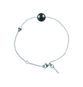 Bracelet Claverin en or blanc 18 carats avec une perle noire de Tahiti de 7 mm et un motif tête de mort