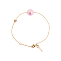 Bracelet Claverin en or jaune 18 carats avec perle rose et motif tête de mort, longueur ajustable 17,5 cm