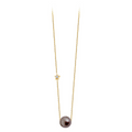 Collier Claverin en or jaune 18 carats avec perle noire de Tahiti et pendentif étoile serti d'un diamant